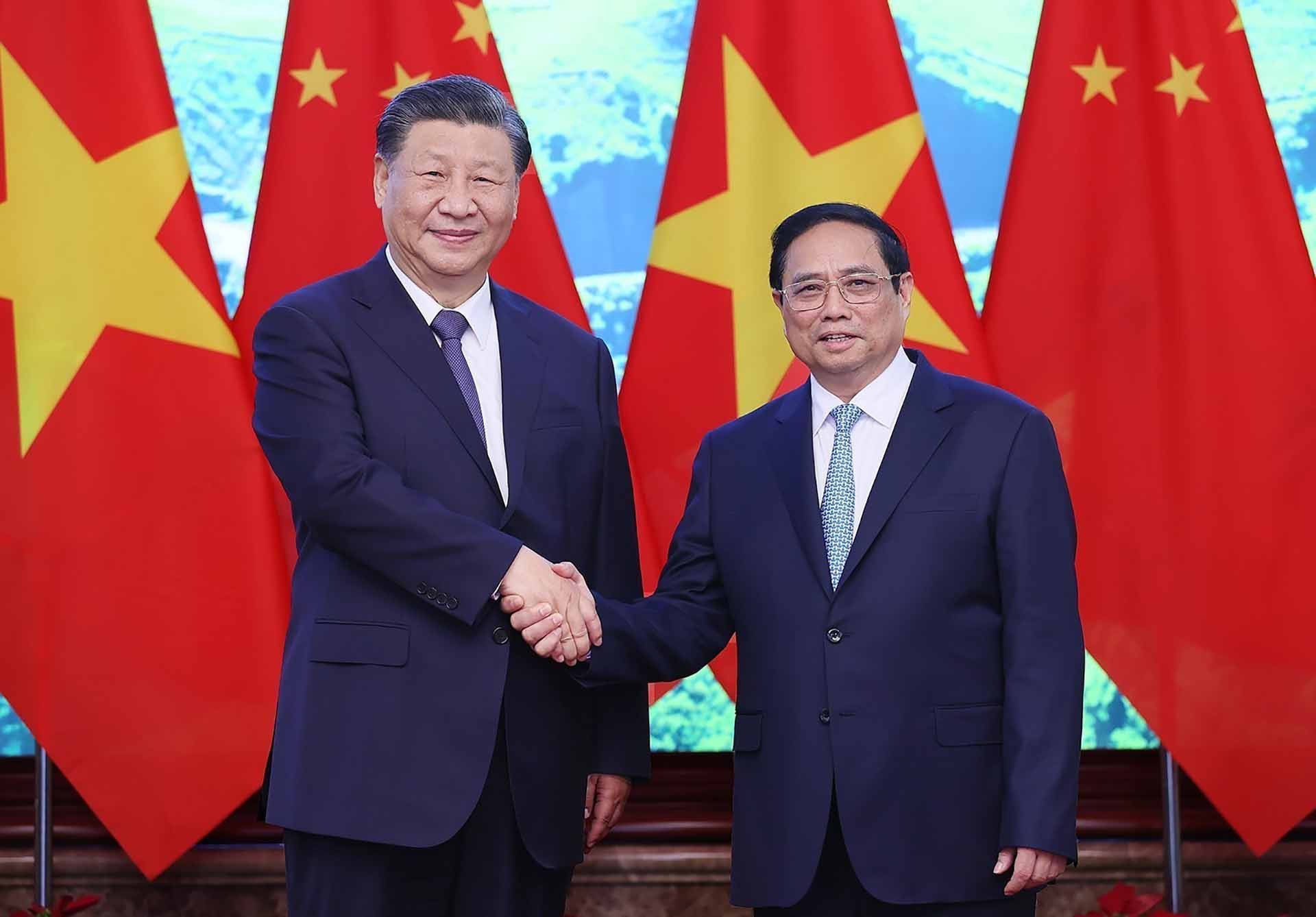 Thủ tướng Phạm Minh Chính và Tổng Bí thư, Chủ tịch nước Trung Quốc Tập Cận Bình chụp ảnh chung. (Nguồn: TTXVN)