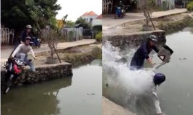 [VIDEO] Bị truy đuổi, hai tên cướp phóng xe bạt mạng "lao nhầm" xuống hồ