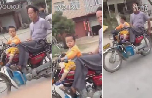 [VIDEO] Ông bố "dại dột" để con trai 2 tuổi lái xe phóng như bay trên đường