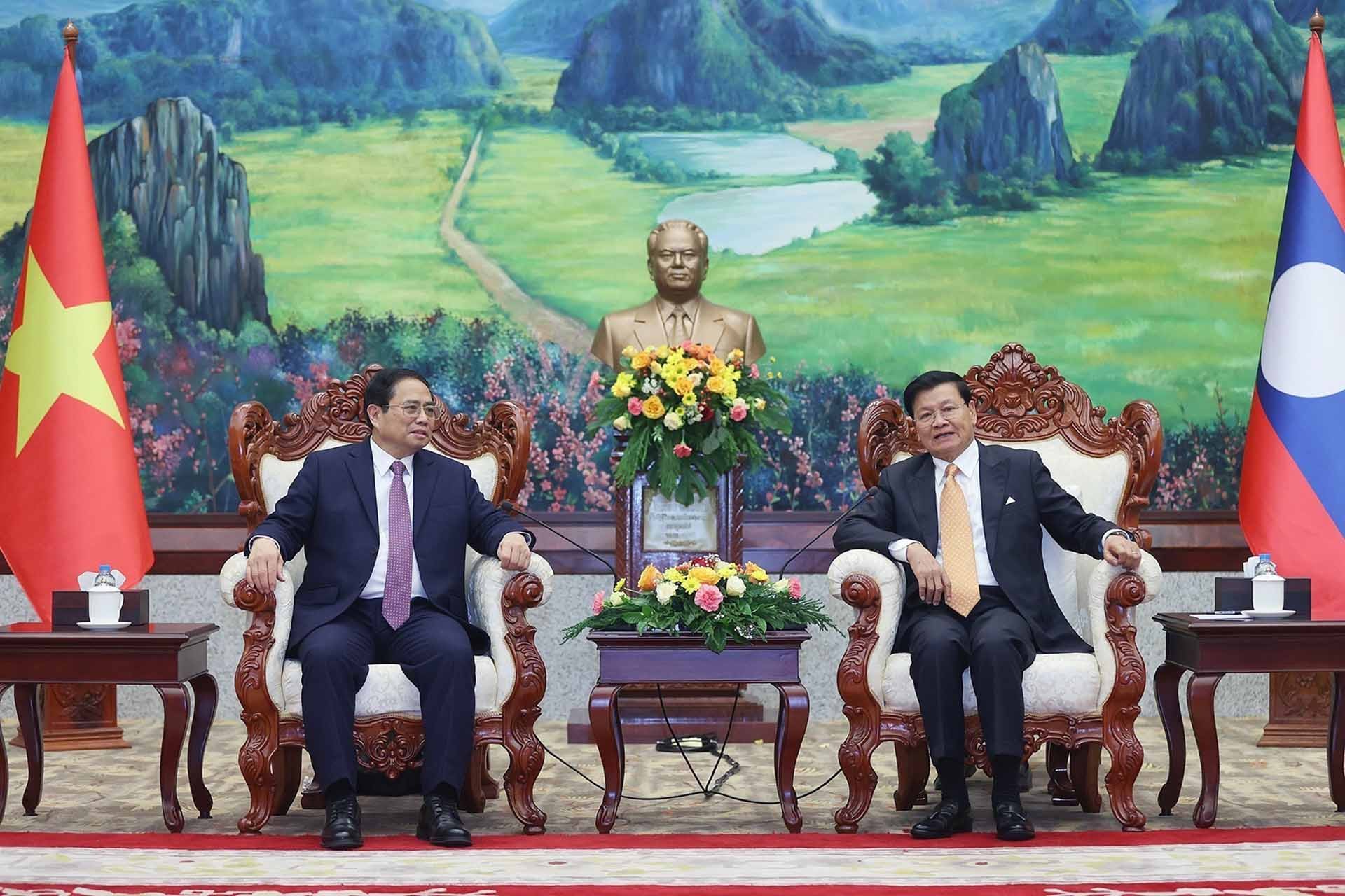Thủ tướng Phạm Minh Chính và Tổng Bí thư, Chủ tịch nước Lào Thongloun Sisoulith. (Nguồn: TTXVN)